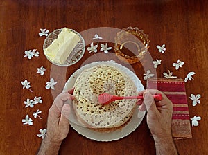 Man hand preparing breakfast with thousand wholes crepe