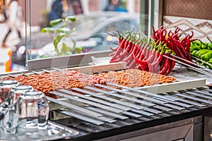 Man hand preparing traditional delicious Turkish shish kebab