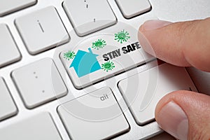 Man hand pressing keyboard enter key to stop virus, stay safe
