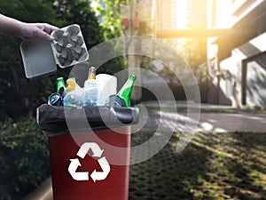 man hand putting plastic reuse for recycling concept environment