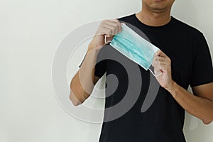 Man hand`s holding medical protective mask