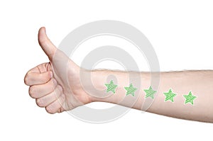 Man hand showing thumbs up and five star rating