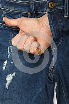 Man hand shows like gesture out of jeans fly