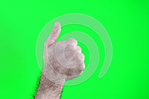 man hand shows thumbs up, isolated on green Happy man giving thumbs up sign full length portrait on white background