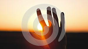 man hand silhouette sunlight. Muslim with man hand sun on light background. christian business love religion concept