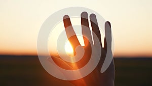 man hand silhouette sunlight. Muslim with man hand sun on light background. christian business love religion concept