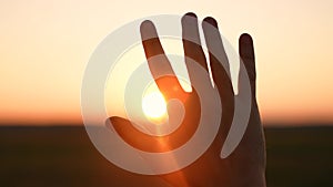 man hand silhouette sunlight. Muslim with man hand sun on light background. christian business love religion concept