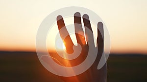 man hand silhouette sunlight. Muslim with man hand sun on light background. christian business love religion concept