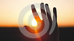 man hand silhouette sunlight. Muslim with man hand sun on light background. christian business love religion concept