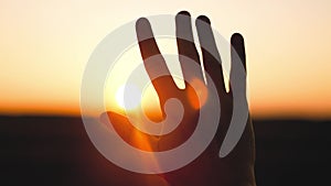 man hand silhouette sunlight. Muslim with man hand sun on light background. christian business love religion concept