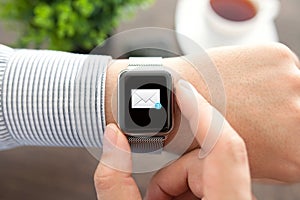 Man hand with smart Watch and mail on the screen