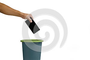 Man hand throws cell phone into trash can on white background