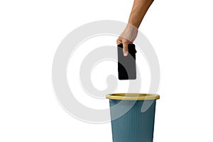 Man hand throws cell phone into trash can on white background
