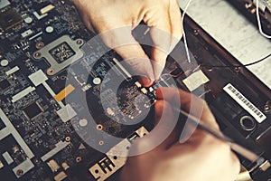 Man hand laptop disassembling