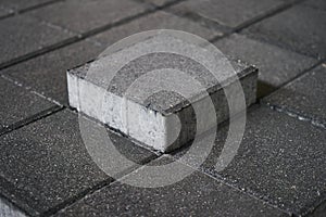 Man hand touch concrete road curbs at the factory