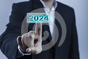 Man hand touching on 2024 calender year button