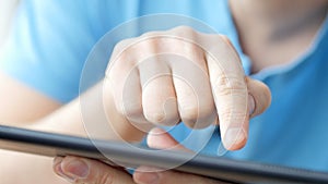 Man hand touching screen on modern digital tablet pc