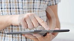 Man hand touching screen on modern digital tablet pc