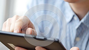 Man hand touching screen on modern digital tablet pc