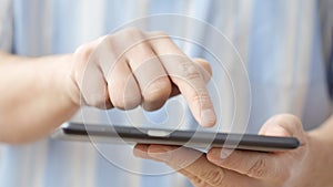 Man hand touching screen on modern digital tablet pc
