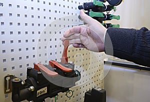 Man hand touching the tumbler of the rotary switch