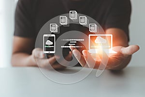 Man hand transfer file in screen, Smartphone and Laptop data transfer.