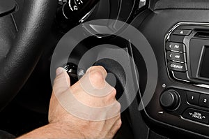 Man hand turning on his car