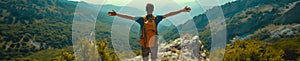 A man with hand up jumping on the top of the mountain