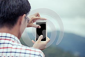 Man hand using cellphone,smartphone,phone to take photo