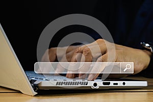 Man hand using computer notebook for searching information,