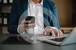 Man hand using tablet ,laptop, and holding mobile with credit card online banking payment shopping