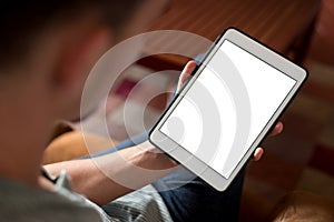 Man hand using white tablet with blank screen.