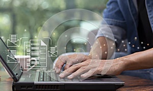 man hand work with laptop and review document and approved with sending e-mail photo