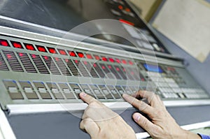 Man hand working on printing machine