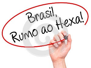 Man Hand writing Brasil, Rumo ao Hexa! with black marker on visual screen. photo