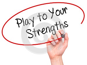 Man Hand writing Play to Your Strengths with black marker on visual screen. photo