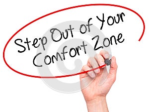 Man Hand writing Step Out of Your Comfort Zone with black marke