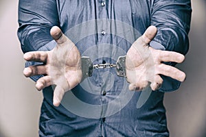 Man with handcuffed hands
