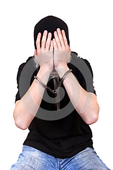 Man in Handcuffs Hide his Face