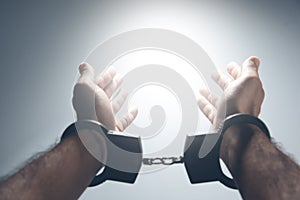 Man handcuffs with light and palm
