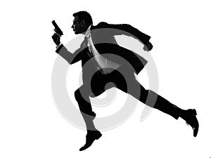Man with handgun running silhouette