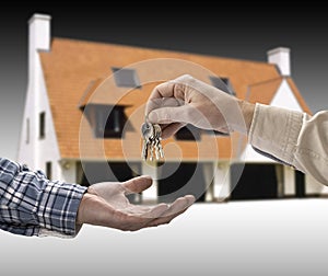 Man is handing a house key