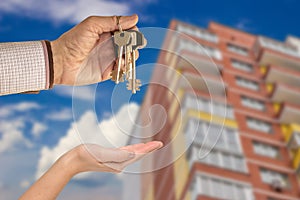 Man handing a key to success over a woman palm