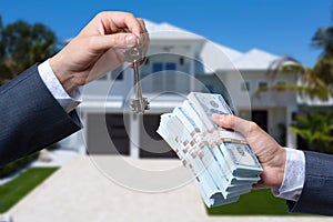 Man Handing a man Thousands of Dollars For Keys in Front of House.