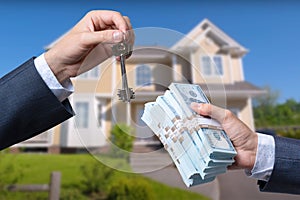 Man Handing a man Thousands of Dollars For Keys in Front of House.