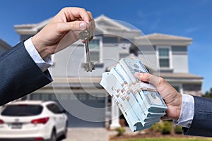 Man Handing a man Thousands of Dollars For Keys in Front of House.