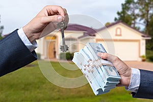 Man Handing a man Thousands of Dollars For Keys in Front of House.