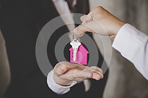 Man handing over the house keys to a new home