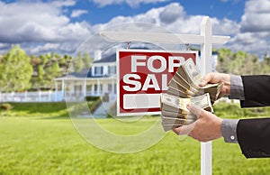 Man Handing Over Money in Front House For Sale, Sign