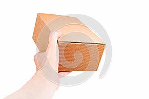 Man handing a small brown closed cardboard package, quick shipment delivery, transportation and product shipping concept